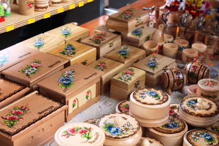 Wooden trinkets in a market near Triple Bridge with traditional Slovene design