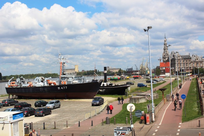 View of parked boat by the river Schelde from the boardwalk