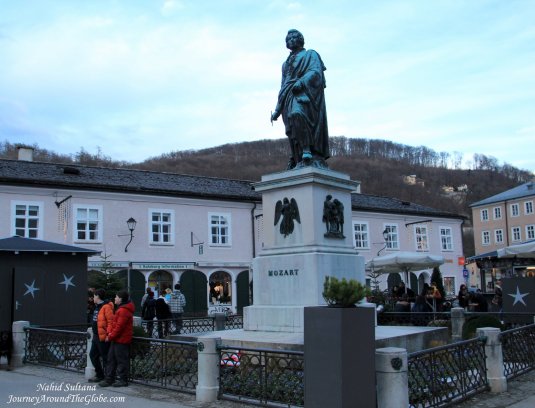 A statue of young Mozart in Mozartplatz, Salzburg, Austria