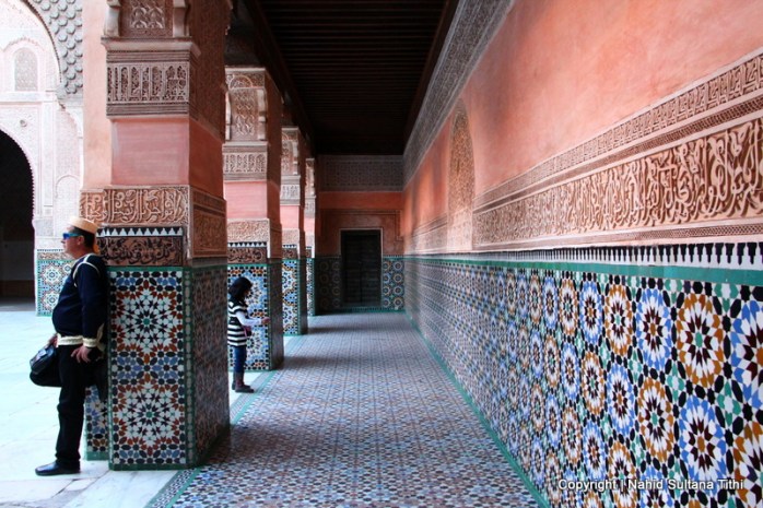 Calligraphic walls in main courtyard of Ben Youssef Madrassa in Marrakech, Morocco