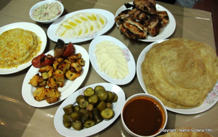 Lunch (chicken kebab, hummus, pickles, bread, and rice near Bethany, Jordan