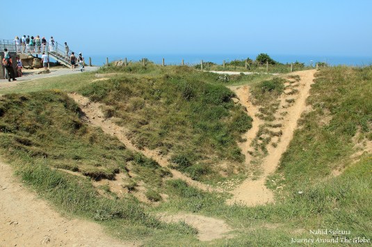 One of many craters that were created due to aerial bombings on Pointe du Hoc during D-day invasion in Normandy, France