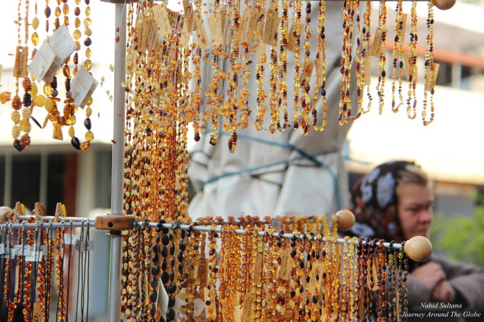 A street vendor selling amber jewelries in old town of Riga