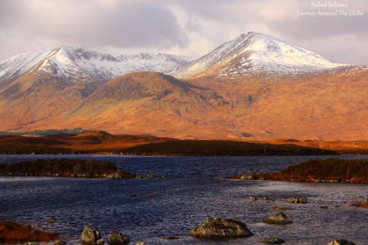 Driving by beautiful scenes of the Highlands in Scotland