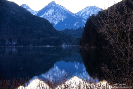 The Alps and its reflection on Lake Alpsee in Fussen, Germany