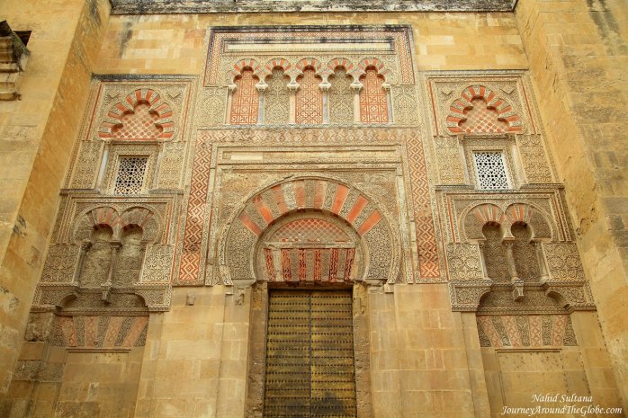 An old gate and exterior wall of Mezquita in Cordoba, Spain