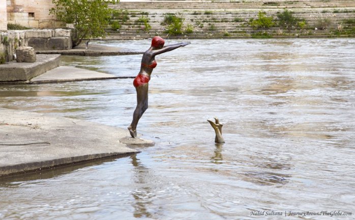 An interesting statue on River Vardar near Stone Bridge in Skopje, Macedonia