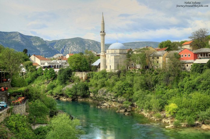 Standing on Stari Most or Old Bridge of Mostar in Bosnia and Herzegovina