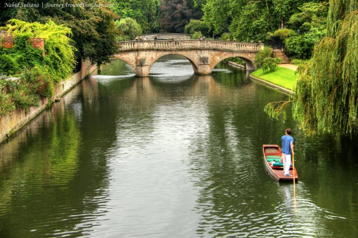 A man punting on River Cam in Cambridge, England